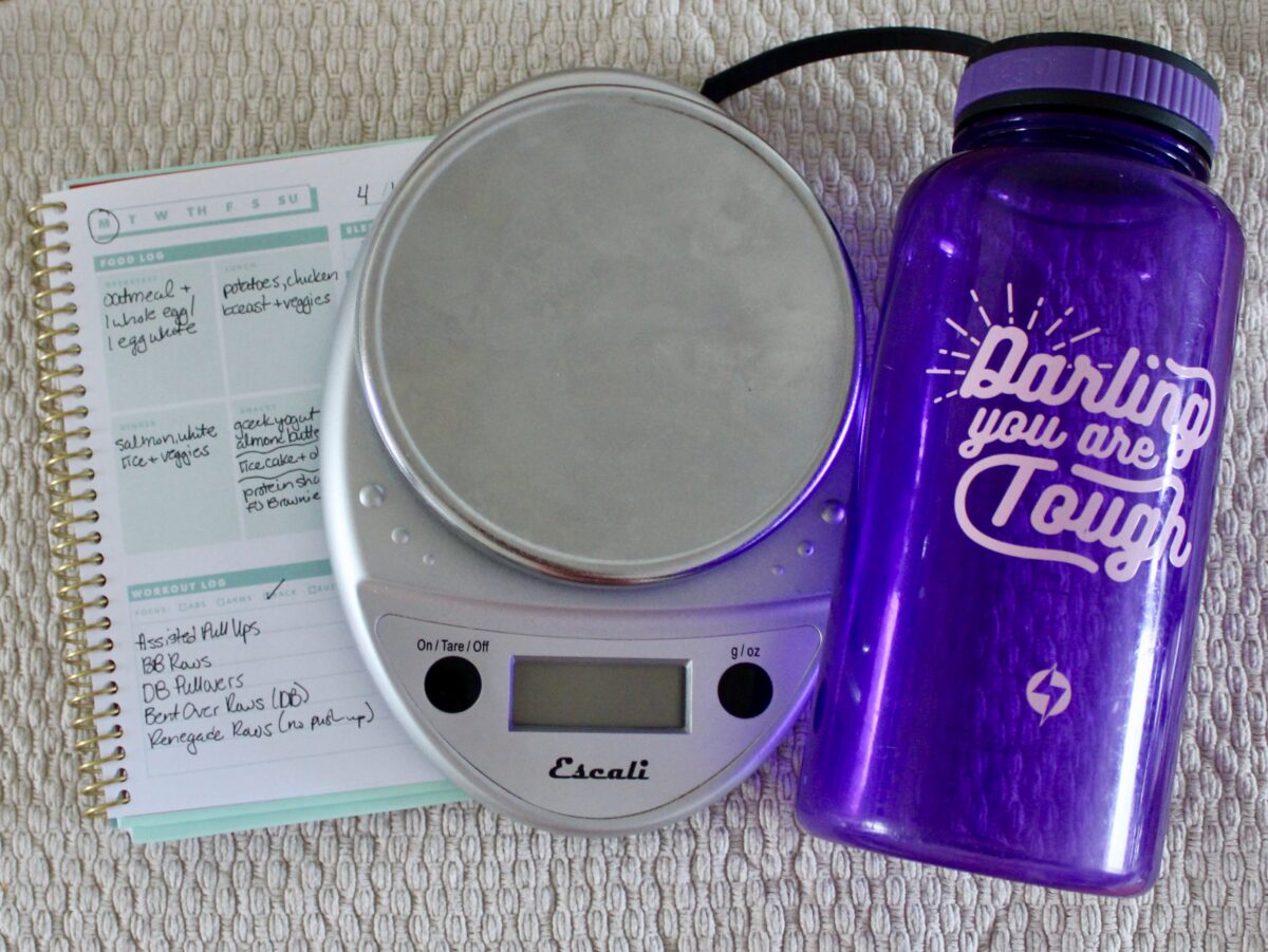 food scale journal and water bottle