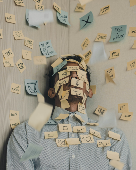 stressed out man with post-its everywhere