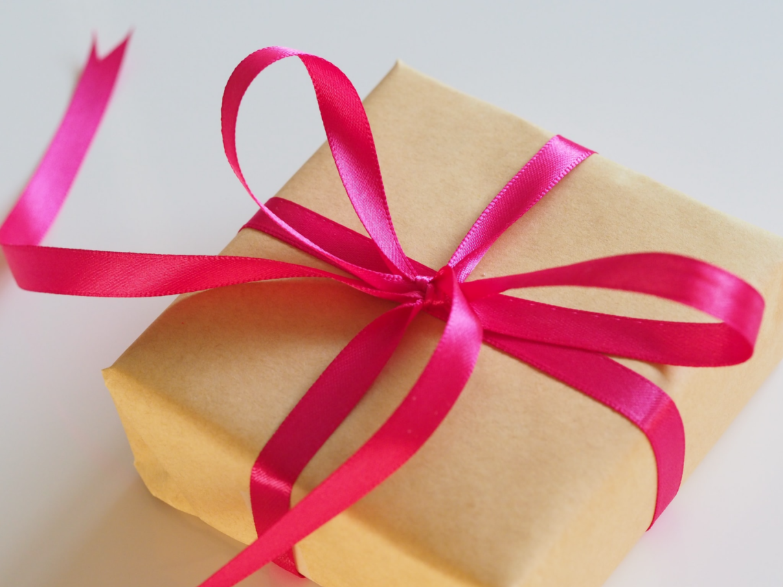 wrapped gift with pink ribbon