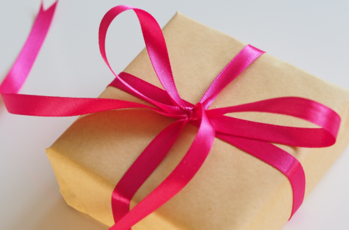 wrapped gift with pink ribbon